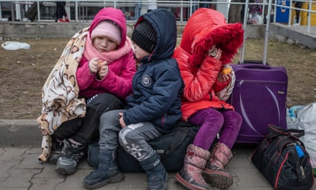 ‘I left everything’: Tens of thousands of Ukrainians seek safety in neighbouring Poland