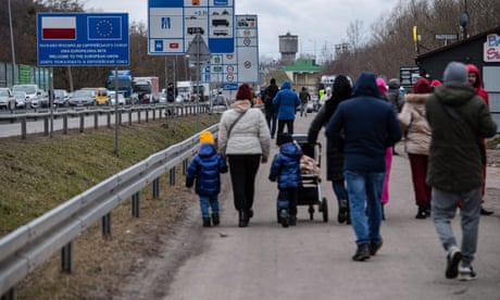 ‘Terrible and fantastical’: fear and farewells on the road out of Ukraine