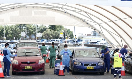 Australia Covid update: record cases on Christmas Day as infections surge in SA, NSW and Queensland