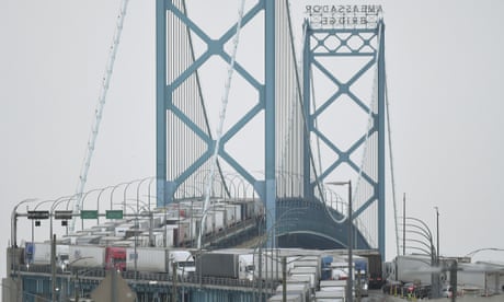 Canadian truckers block main bridge to US as Trudeau demands end to protest