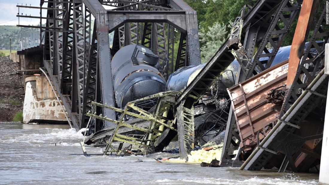 Cleanup begins at the site of a Montana train derailment and Yellowstone River bridge collapse