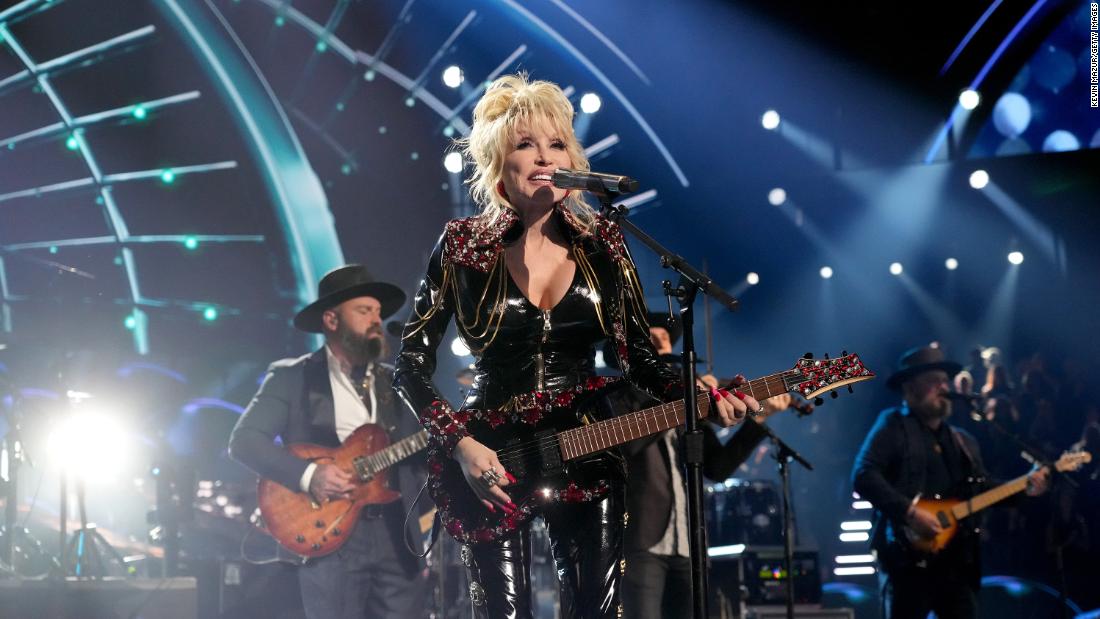 Dolly Parton jokes she'll 'hopefully drop dead in the middle of a song' someday before she ever retires