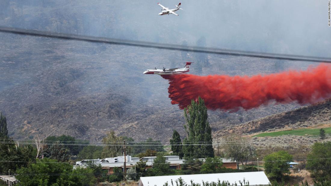 Explosive wildfire crossed US-Canada border, forcing evacuations