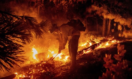 Firefighters shield California town from flames as they gain against biggest blaze