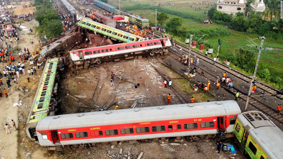 Indian Prime Minister Narendra Modi visits the scene of train crash that killed more than 280 in India