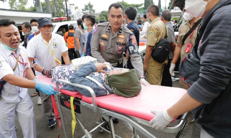 Indonesian earthquake: rescuers search for survivors trapped in rubble