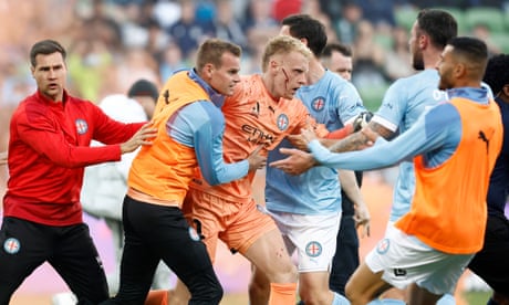 Melbourne A-League derby abandoned as fans storm pitch and keeper attacked