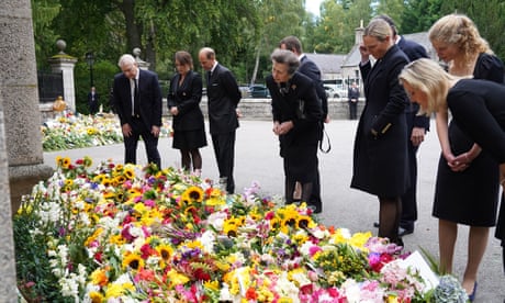 Members of the royal family inspect floral tributes at Balmoral