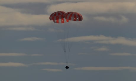 Nasa’s uncrewed Orion capsule splashes down after ‘historic’ moon mission