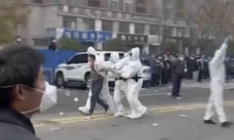 Police beat protesting iPhone workers as Covid cases hit record high in China