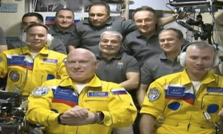 Russian cosmonauts board ISS wearing colours of Ukraine flag