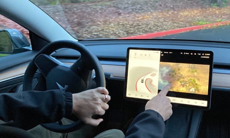 Tesla, bowing to pressure, stops allowing drivers to play video games while driving