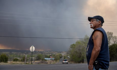 Thousands flee New Mexico wildfire as blaze breaches containment lines