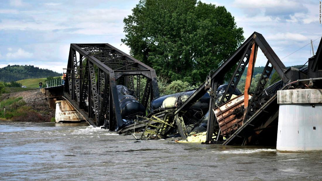 Train derailment on Montana bridge sends multiple rail cars into the Yellowstone River