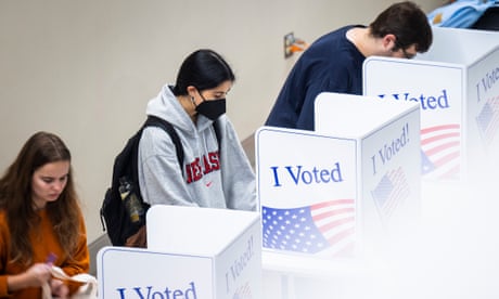Voters hold political fate of US in their hands as they cast midterm ballots